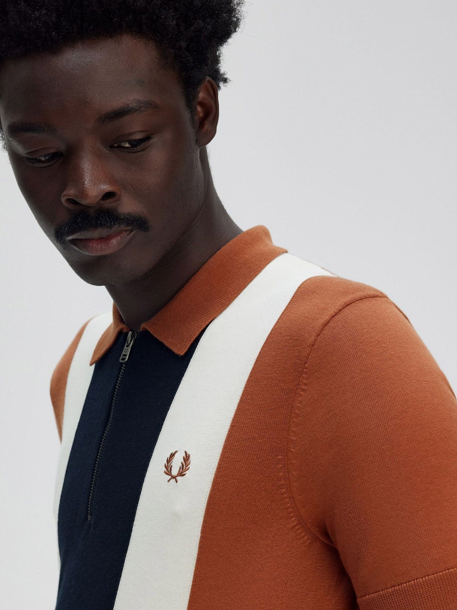 Cotton knit polo shirt with striped motif