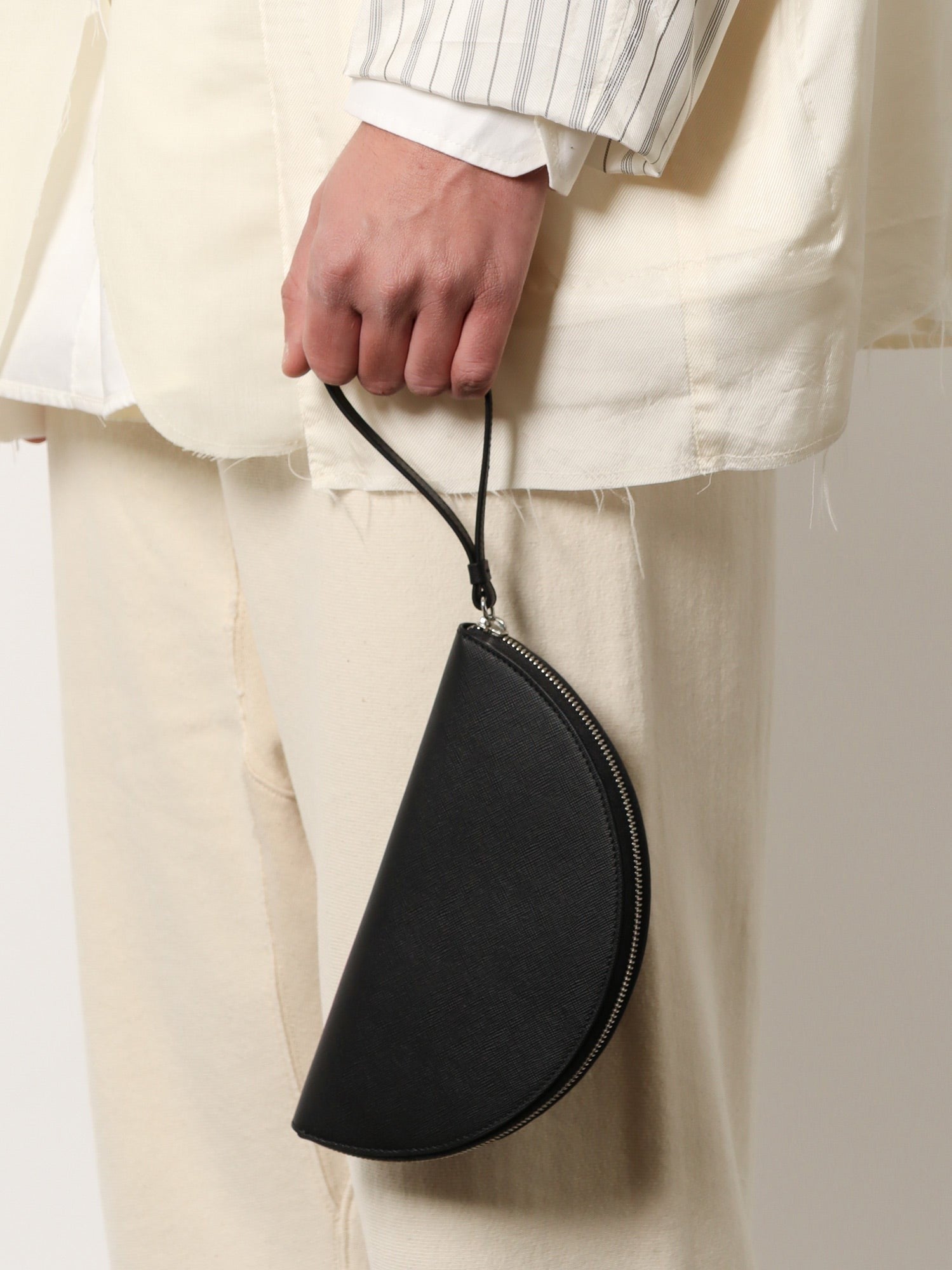 Leather pochette with iconic four stitched detail