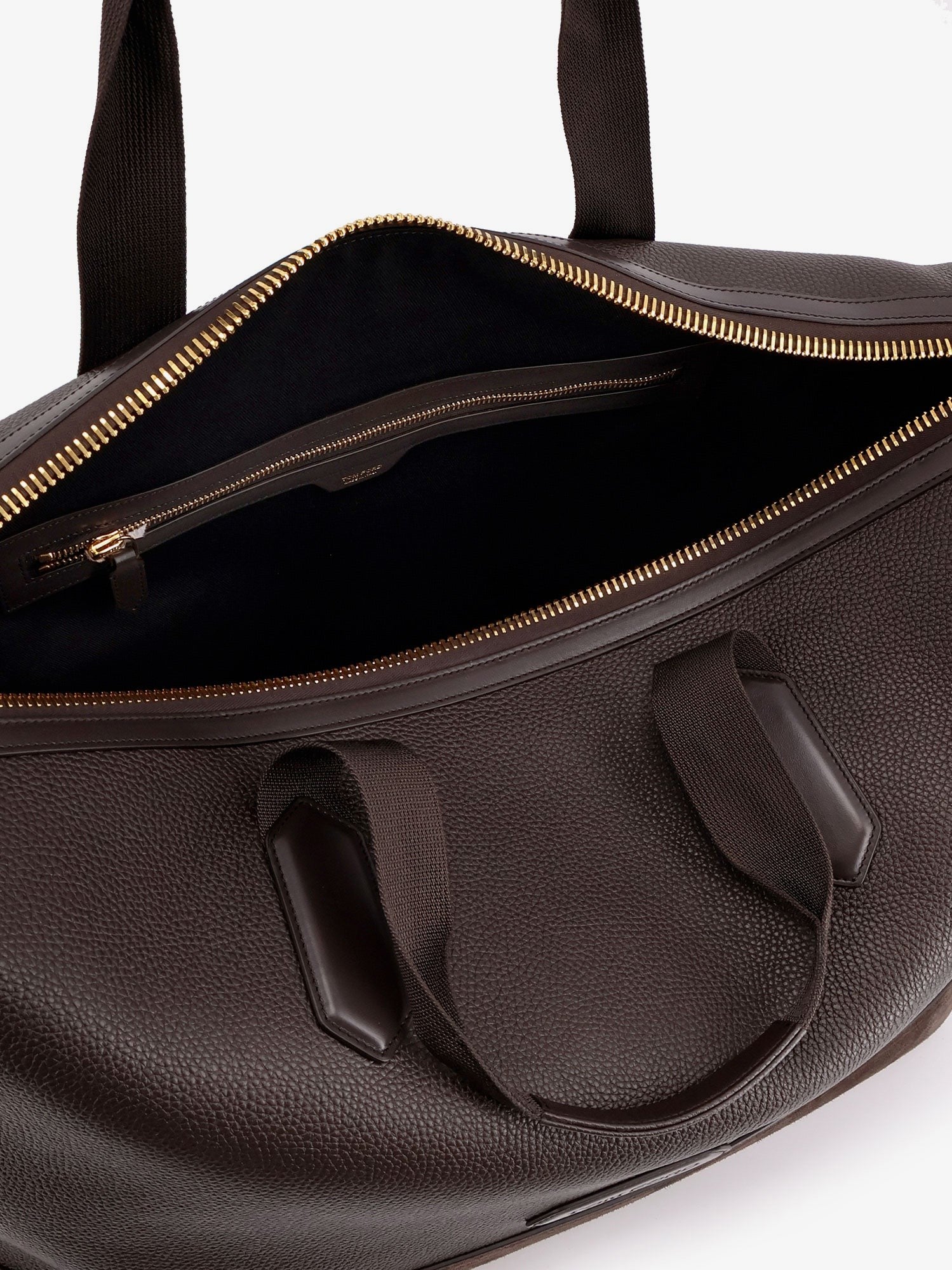 Leather travel bag with suede inserts