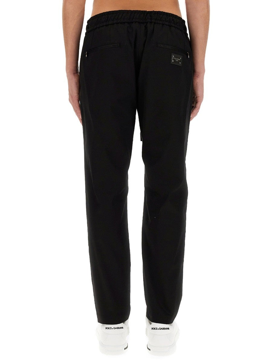 JOGGING PANTS WITH PLAQUE