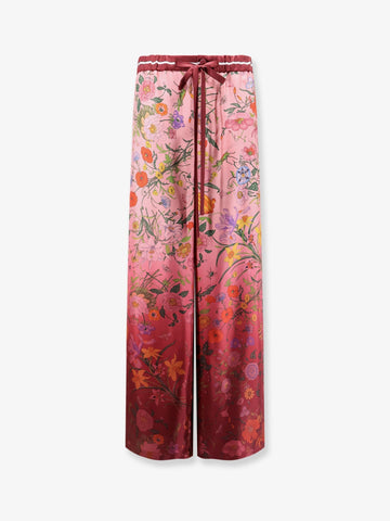 Silk trousers with Gucci Flora print