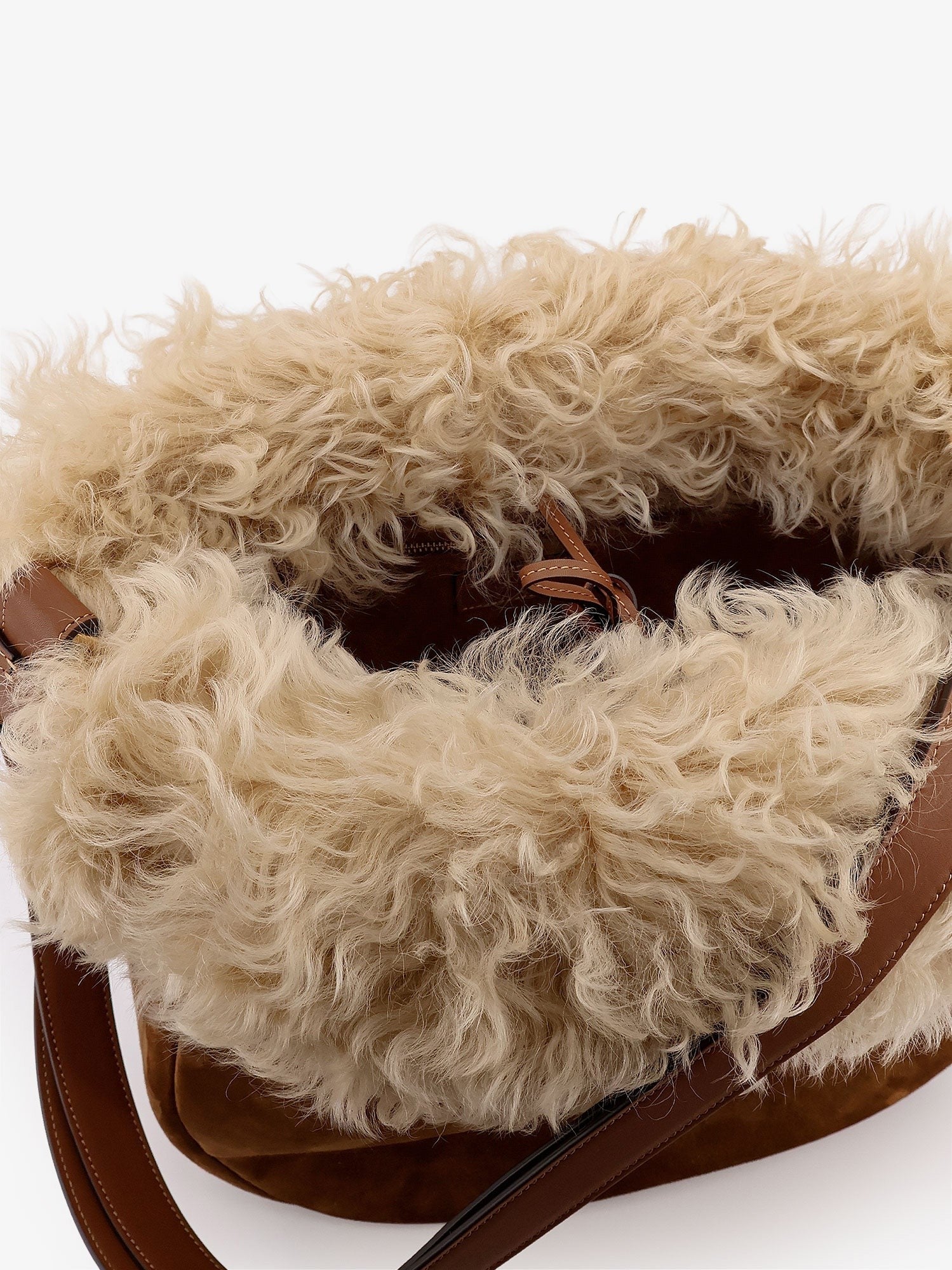 Suede shoulder bag with shearling profile