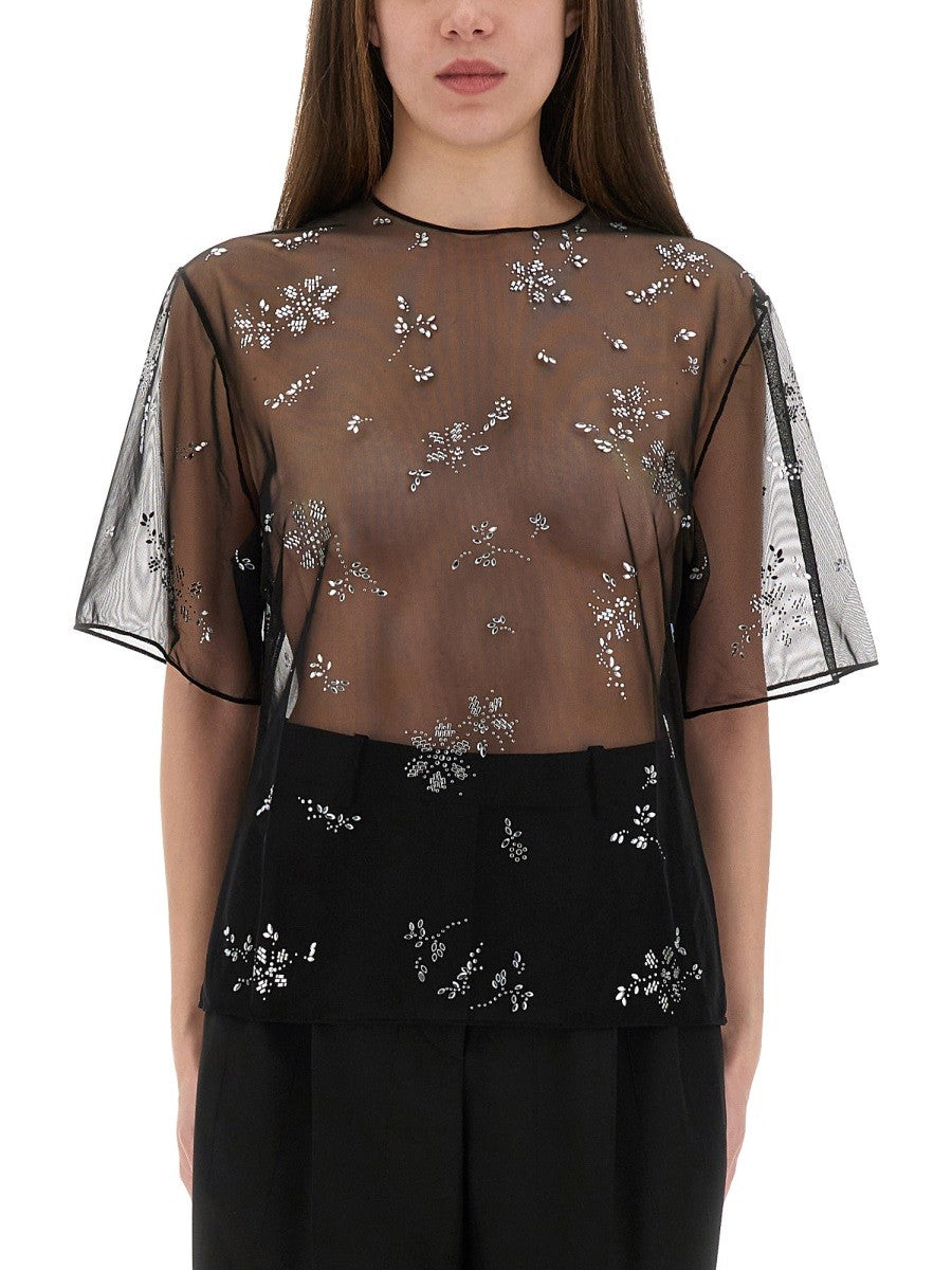 TRANSPARENT TOP WITH APPLICATIONS