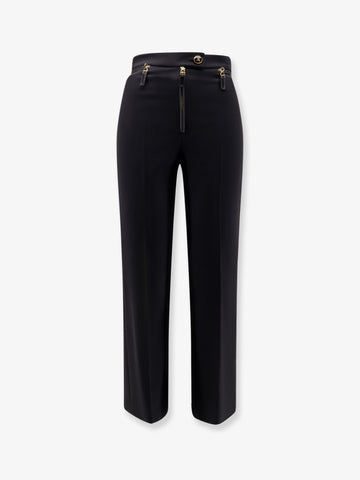 Trousers with logoed button