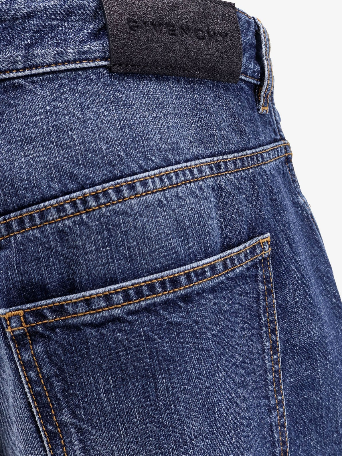 Twisted stone-washed denim jeans