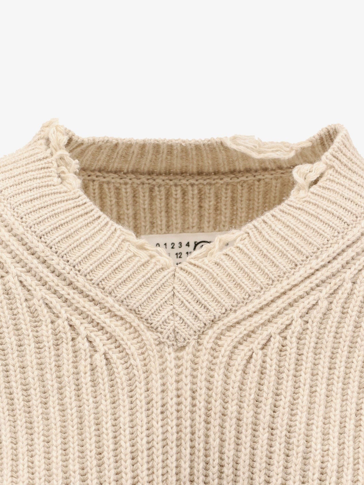 Wool blend sweater with distressed effect