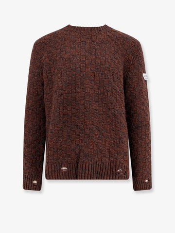 Wool blend sweater with distressed effect