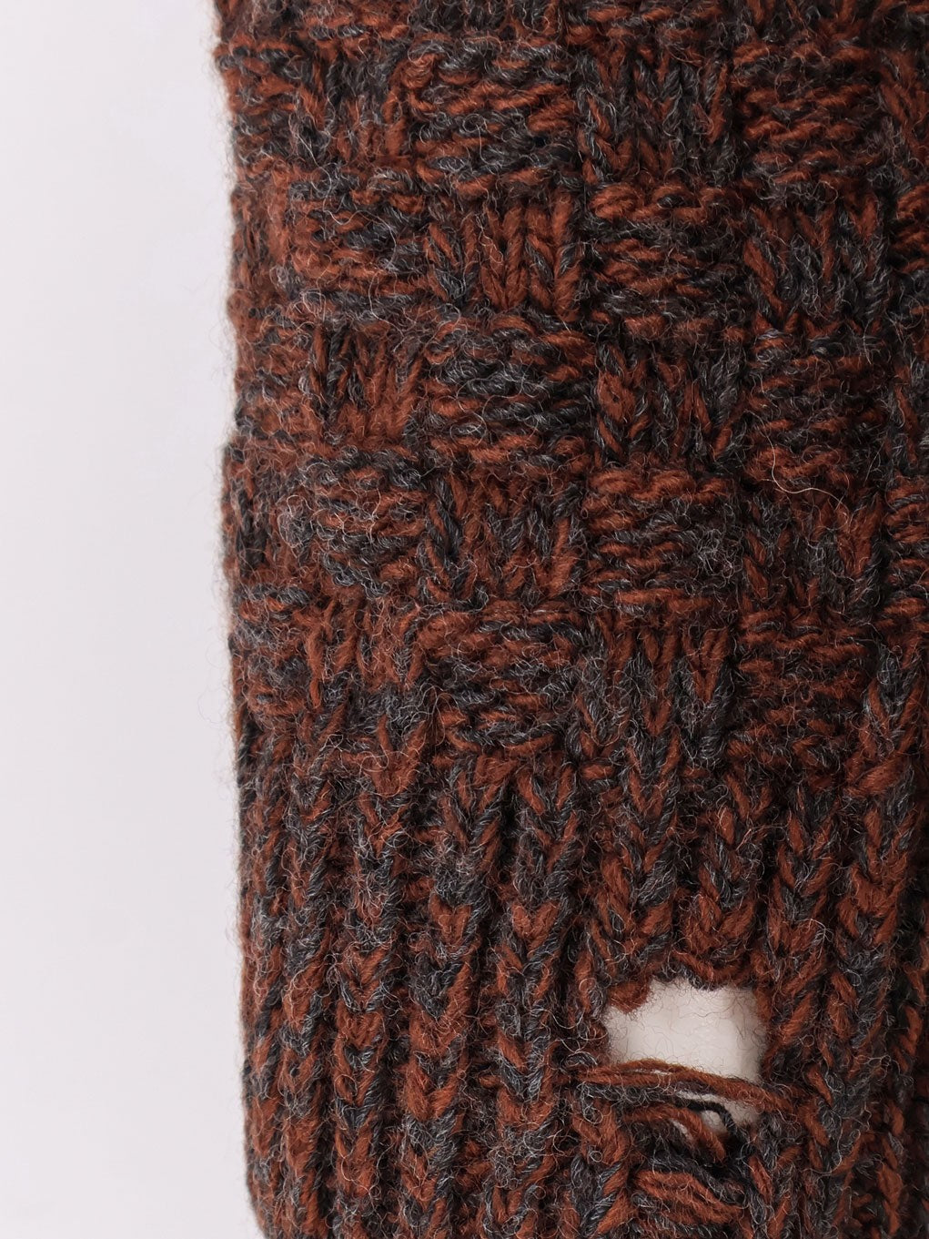 Wool blend sweater with distressed effect