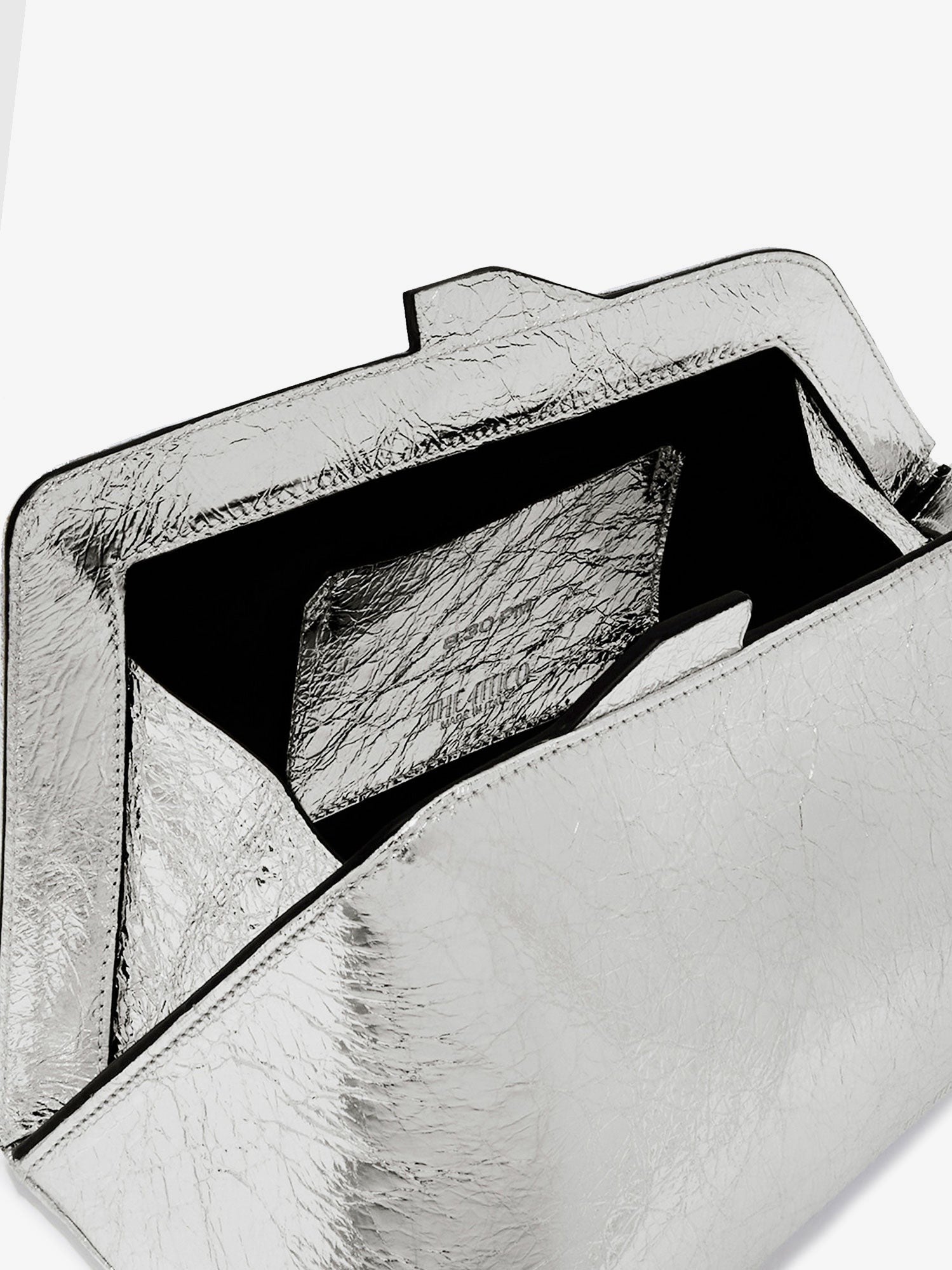 The Attico 8.30 PM laminated leather clutch bag with logo engraved on the bottom