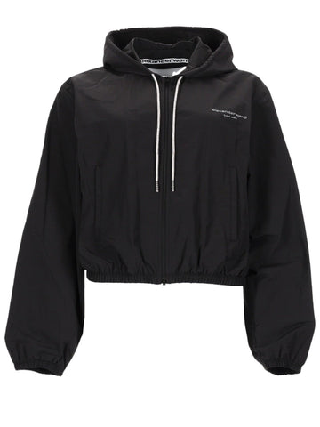 Alexander Wang black cropped hooded jacket for women featuring a front zip closure, drawstring hood, logo detail, and elastic hem.