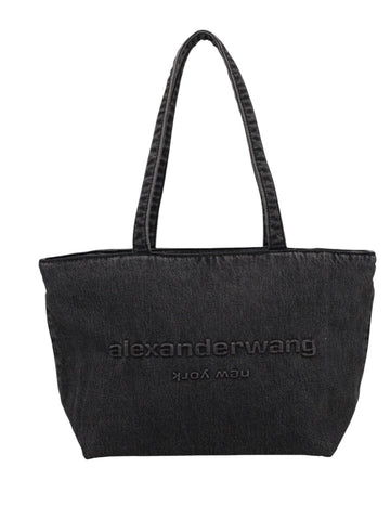 Alexander Wang medium tote bag in black denim with long shoulder handles and tonal embroidered logo across the front.