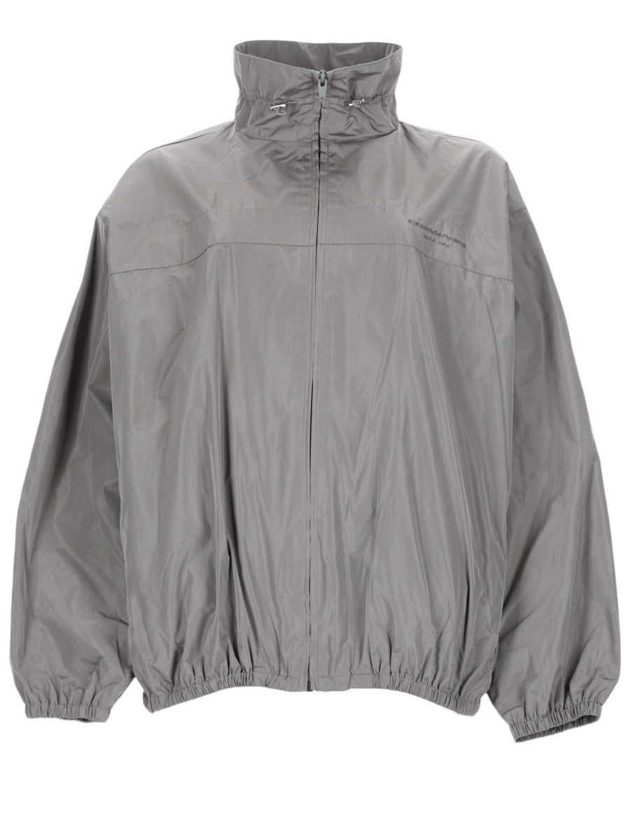 Alexander Wang women's gray technical jacket with front zip closure, high neck, and elastic hem – front view.