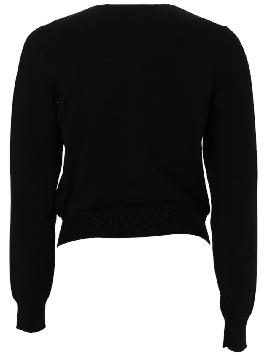 Back view of the Alexander Wang Logo Cardigan in black knit, showing the clean cropped silhouette, long sleeves and ribbed hem.