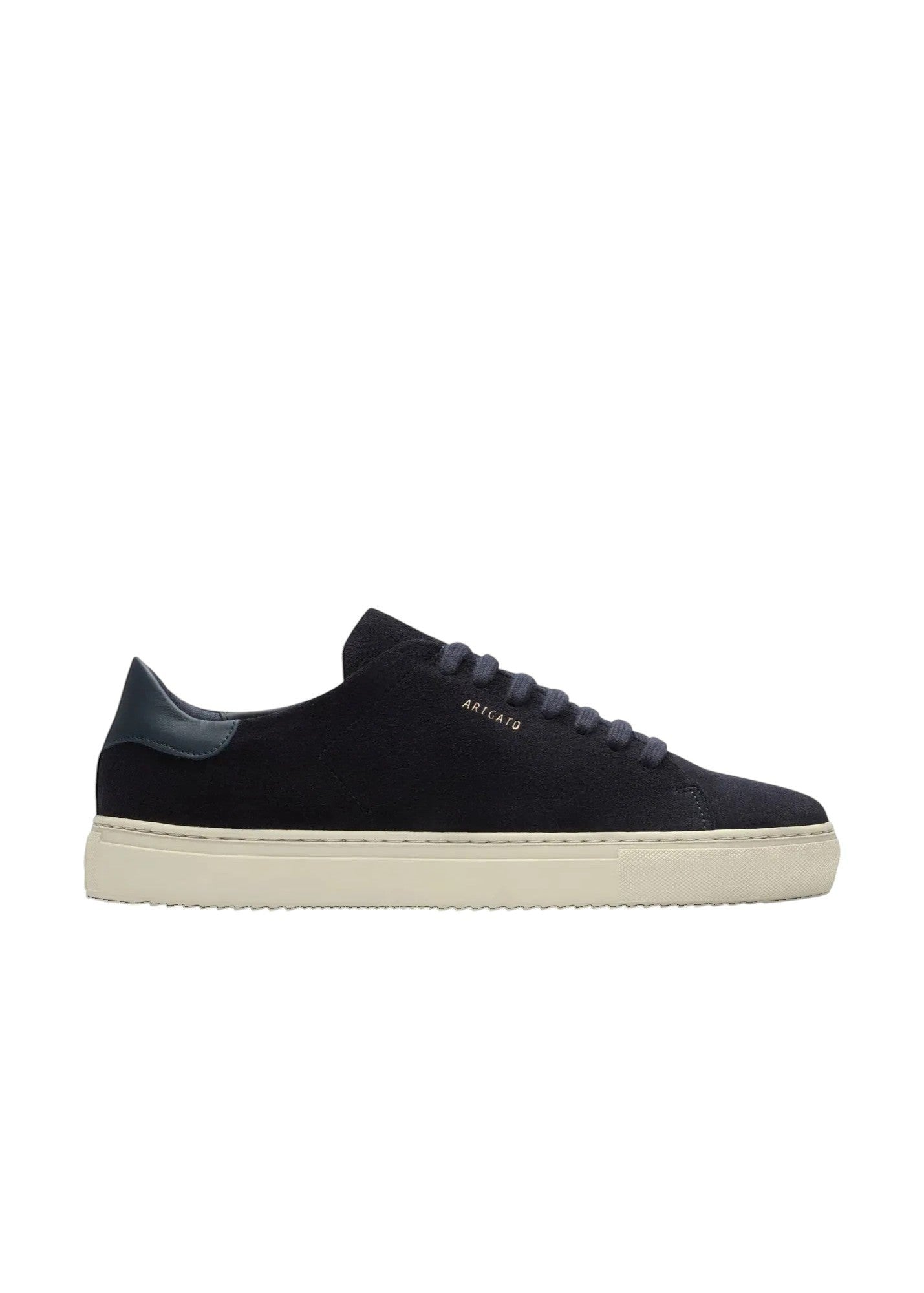 Side profile of Axel Arigato navy suede sneakers with gold logo branding and off-white cupsole.
