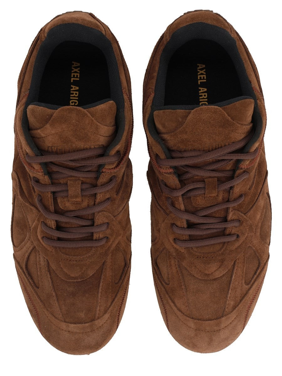 Top view of the AXEL ARIGATO Slow Runner sneaker in brown suede with tonal laces, padded tongue and black inner lining.
