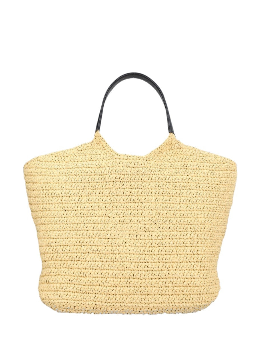 Back view of the Balmain Crochet Shopper Bag in natural, featuring a hand-crocheted raffia construction with black leather shoulder handles.