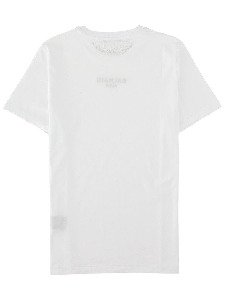 Back view of the Balmain Embroidered Logo T-Shirt in white, showing the clean cotton jersey construction and short sleeves.