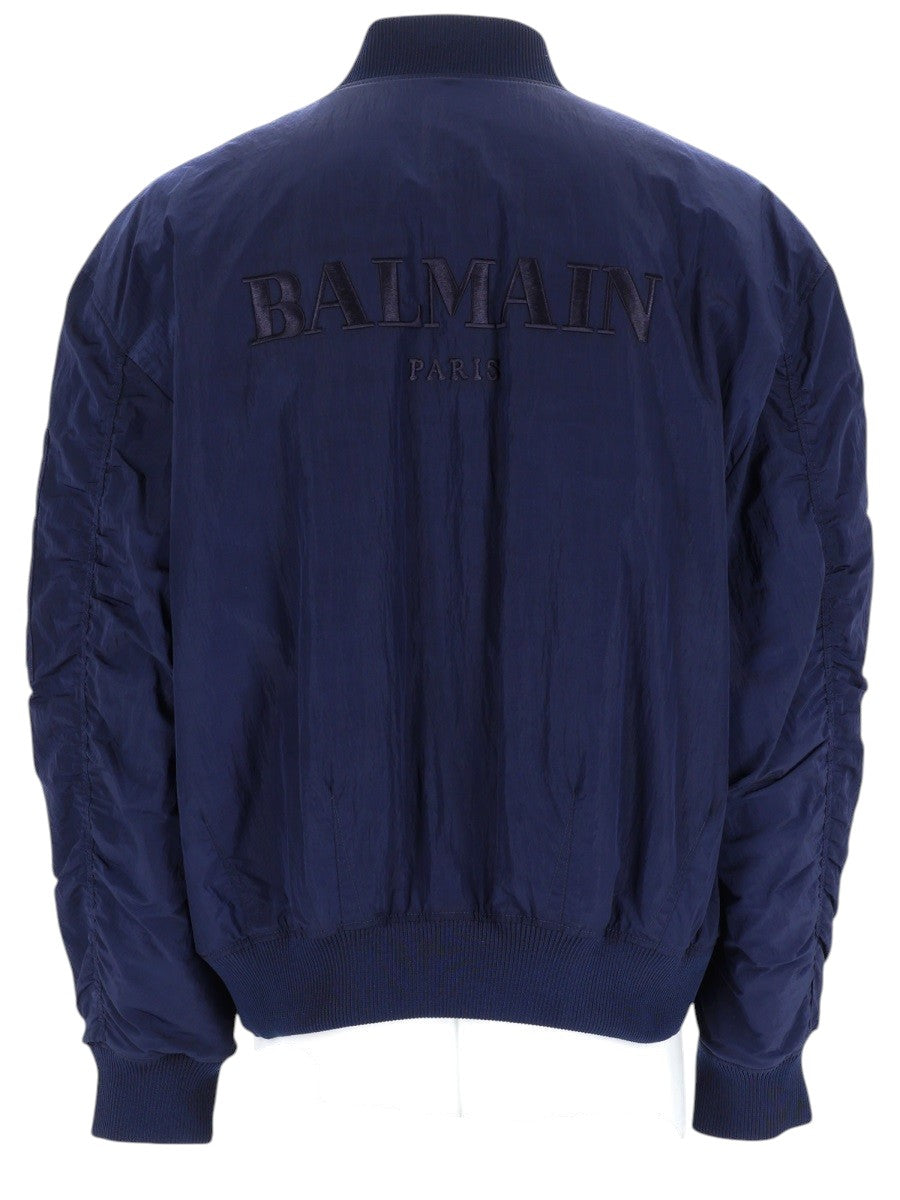 Balmain - BOMBER CON LOGO RICAMATO balmain-navy-blue-nylon-bomber-jacket-back-jpg