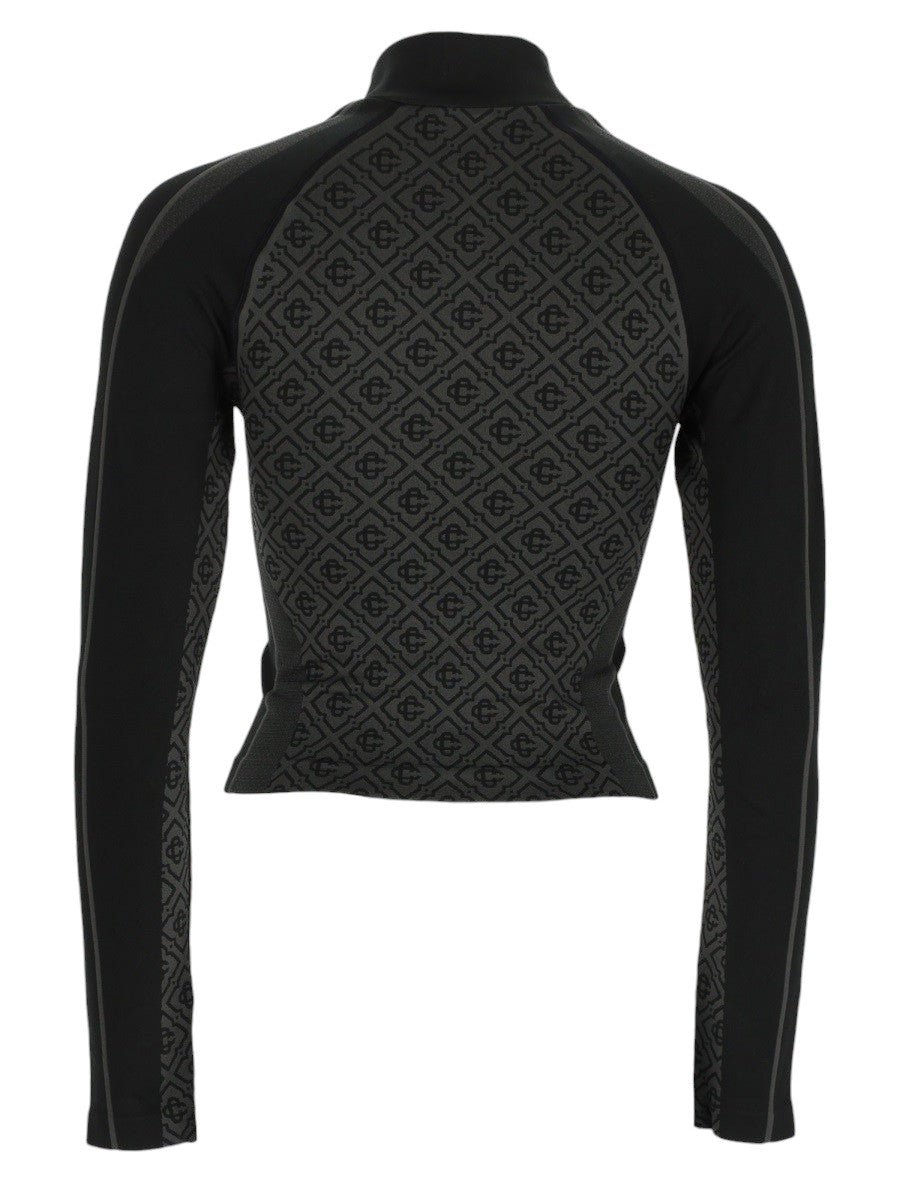 Back view of CASABLANCA black seamless top with tonal monogram pattern and long sleeves