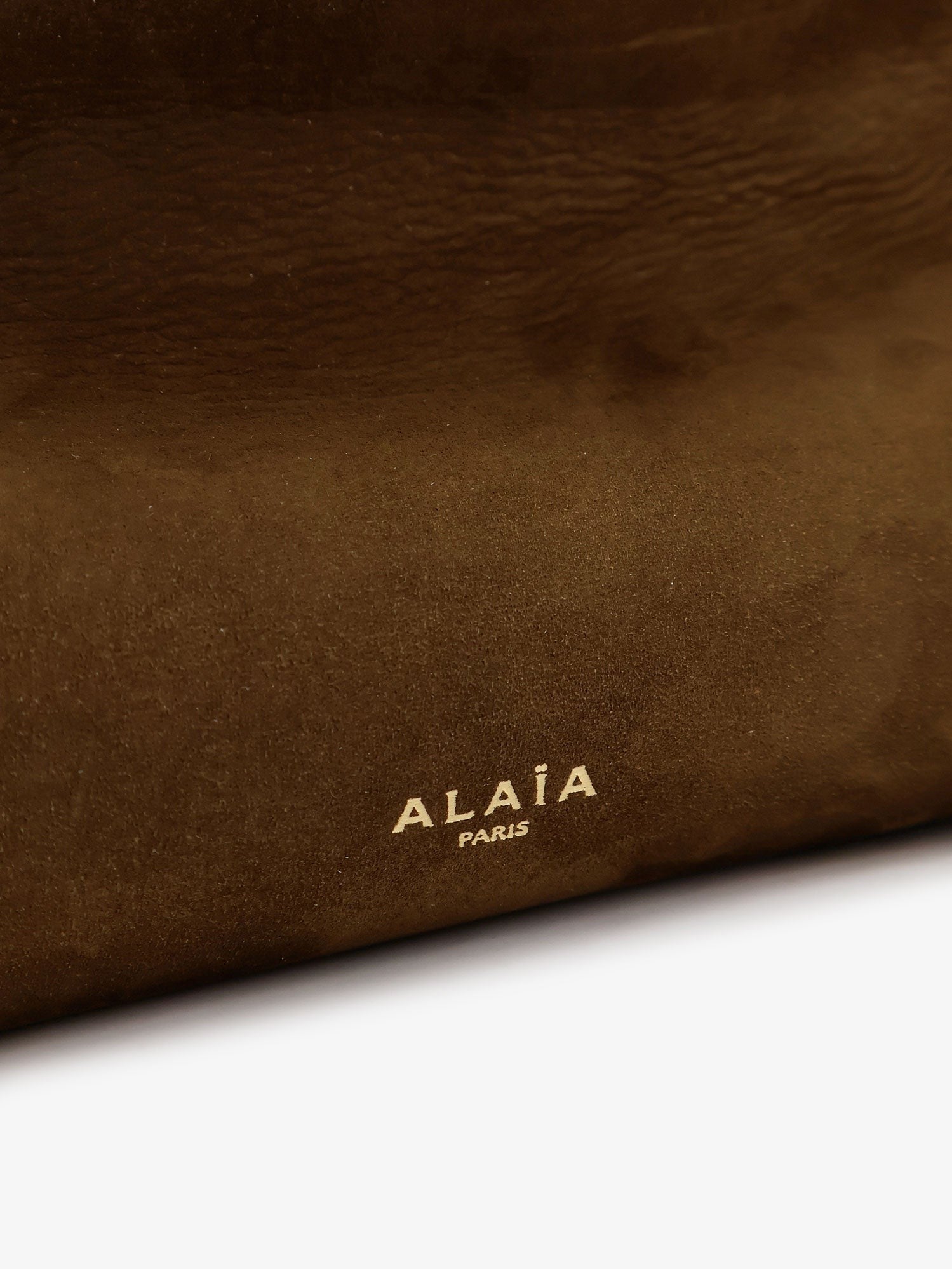 ALAIA - East West leather shoulder bag with engraved logo lettering