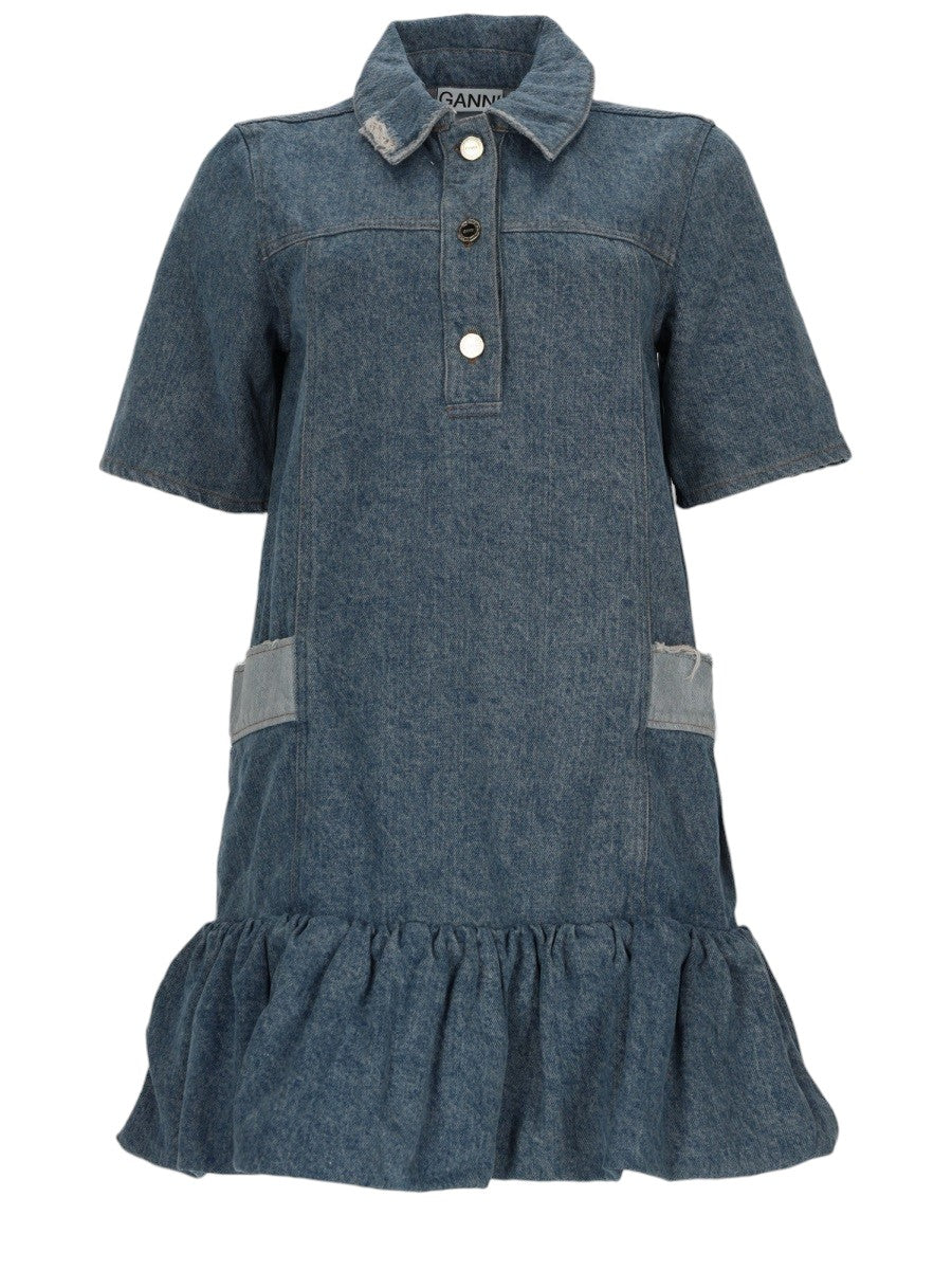 GANNI Patchwork Denim Mini Dress in blue, front view with short sleeves, buttoned polo collar, side patch pockets and gathered ruffle hem.