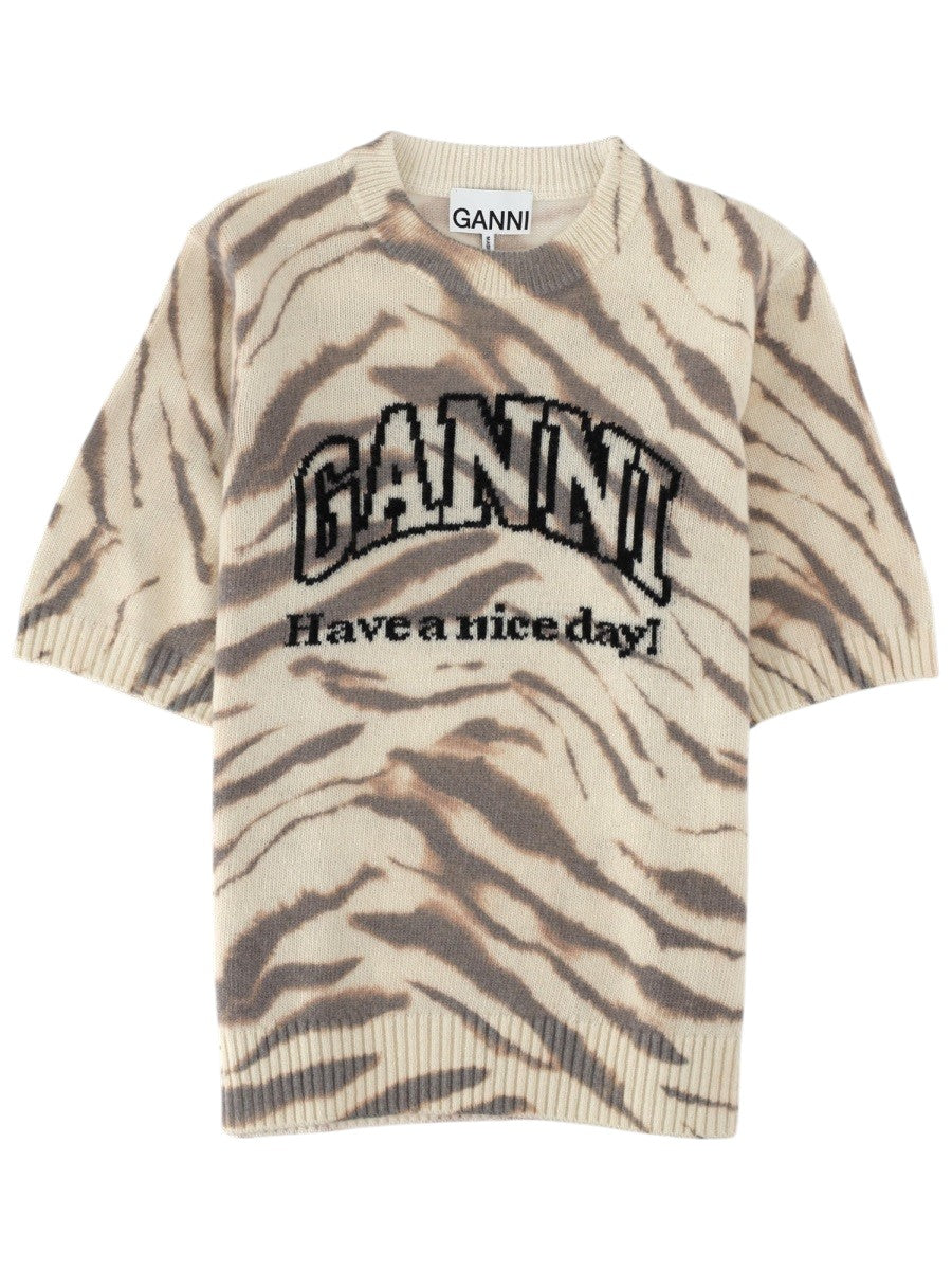 Front view of GANNI beige short sleeve knit top with bold logo lettering and animal stripe print