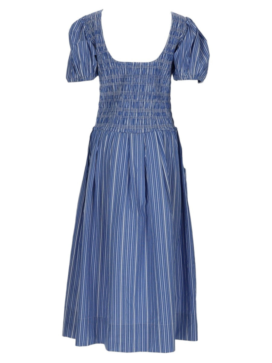 Back view of GANNI striped cotton dress showing gathered waist, full midi skirt and structured puff sleeves