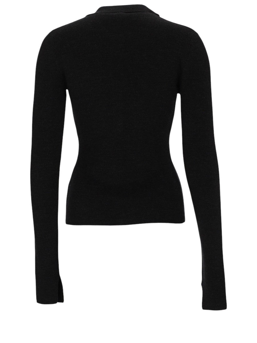 Back view of GANNI black wool knit polo with fitted silhouette and long sleeves