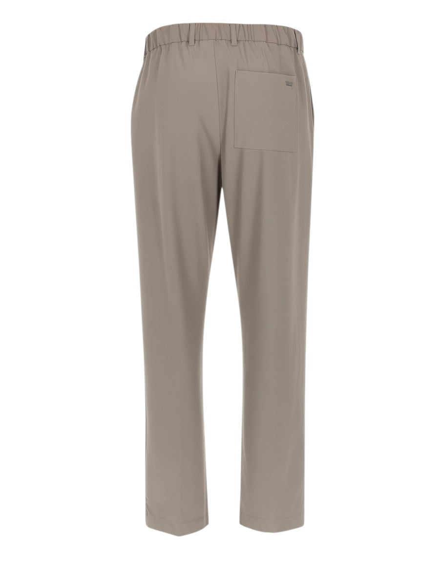 Klosmo Herno beige technical fabric trousers with elastic waistband and back pocket, back view