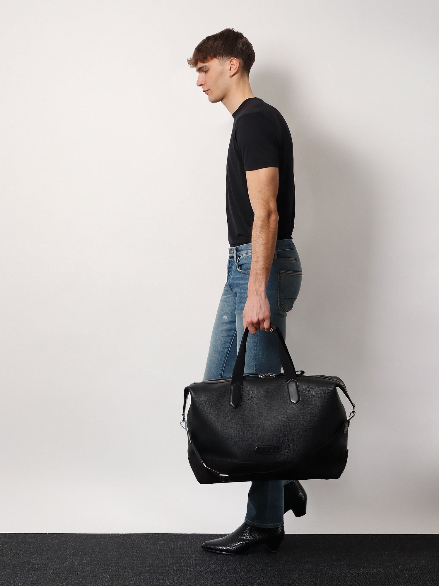 Leather duffle bag with suede inserts and logo patch