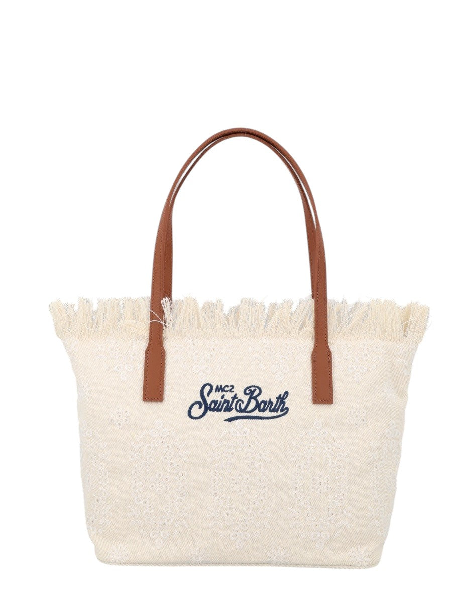 MC2 Saint Barth City Medium canvas tote bag in ivory featuring embroidered decorative motifs, frayed top edge and tan leather shoulder handles.
