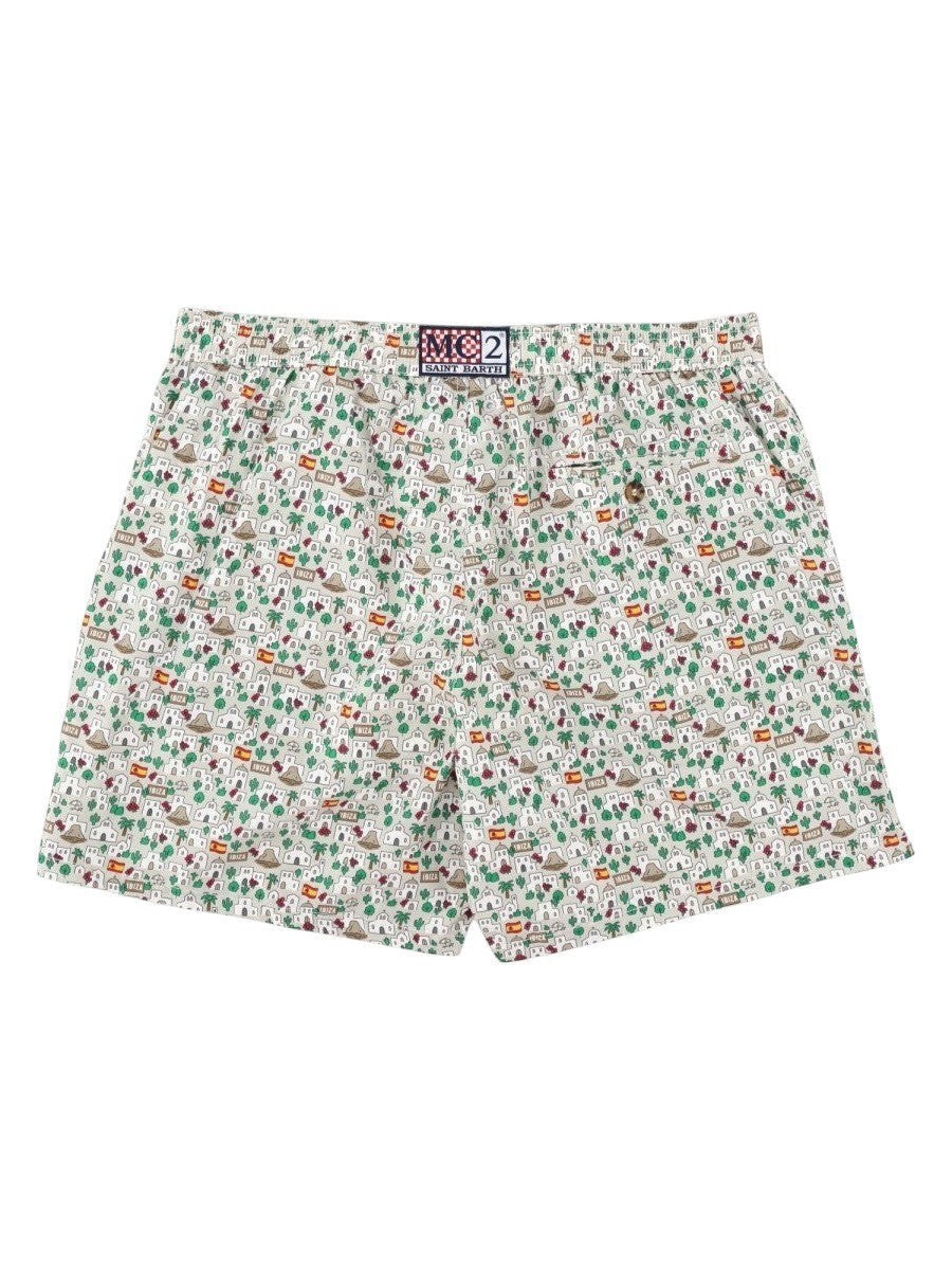 MC2 SAINT BARTH men's printed swim shorts with rear logo patch, back flap pocket and all-over white multicolor island motif.