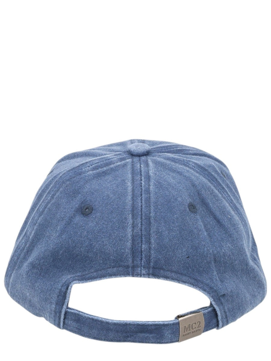 Back view of MC2 Saint Barth blue washed cotton baseball cap featuring an adjustable strap with engraved metal buckle fastening.