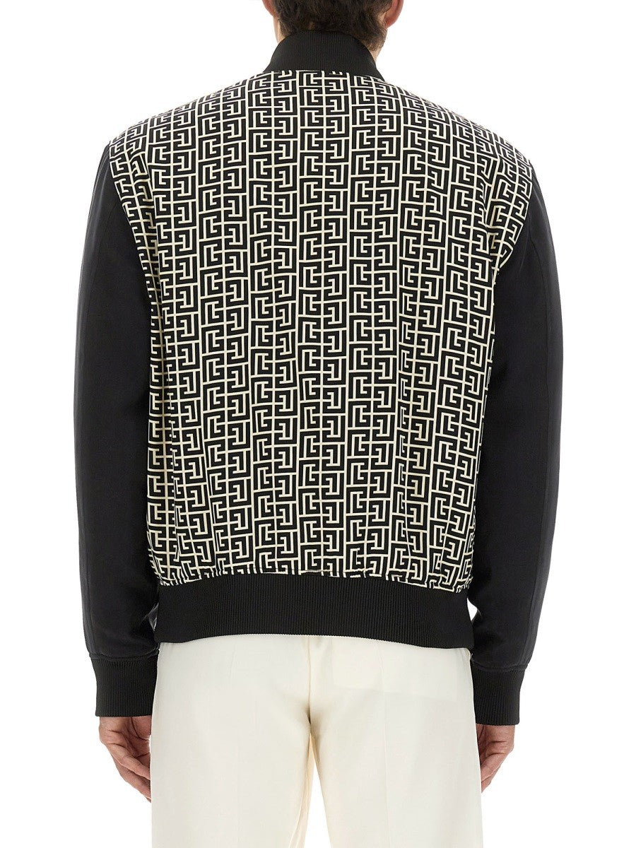 Balmain MONOGRAMMED VARSITY JACKET WITH PATCHES