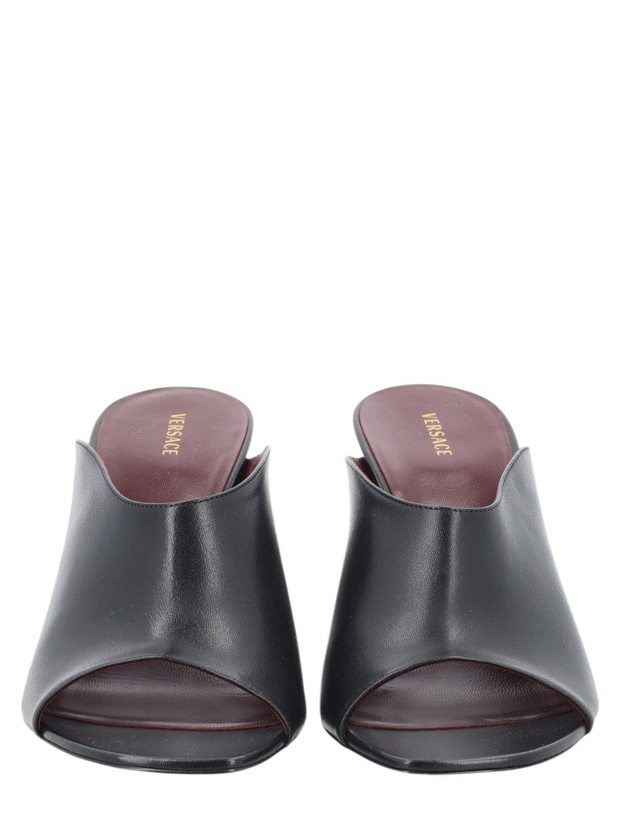 Versace black leather Giulietta mules with a 8cm heel and burgundy interior. Made in Italy.