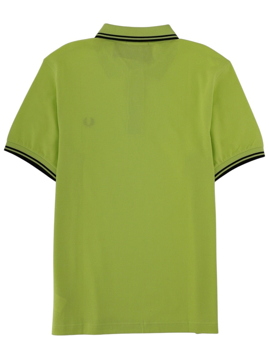 Fred Perry Green polo shirt with black stripes and black logo