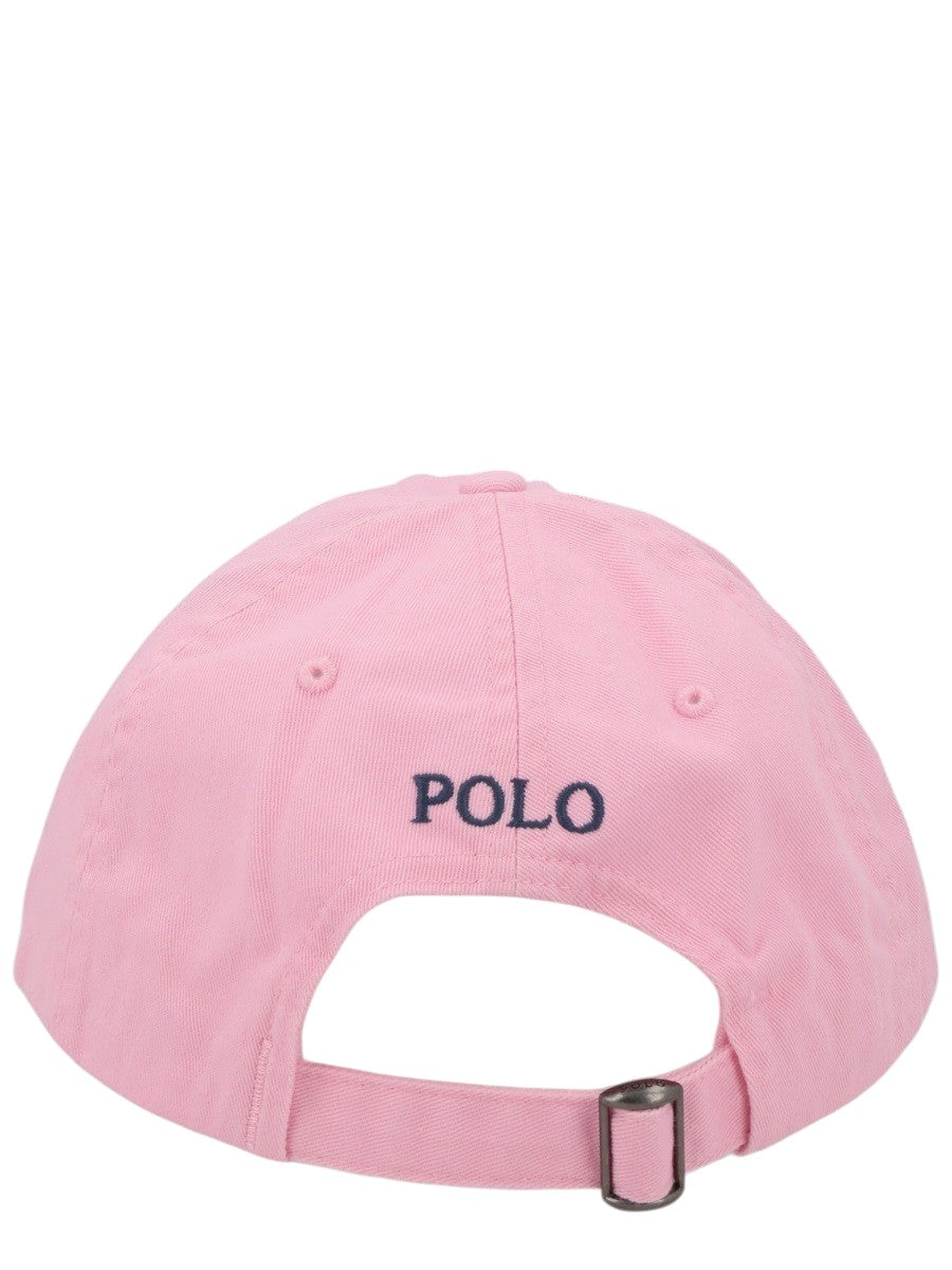 Back view of Polo Ralph Lauren pink cotton chino baseball cap featuring Polo embroidery and an adjustable buckle strap fastening.