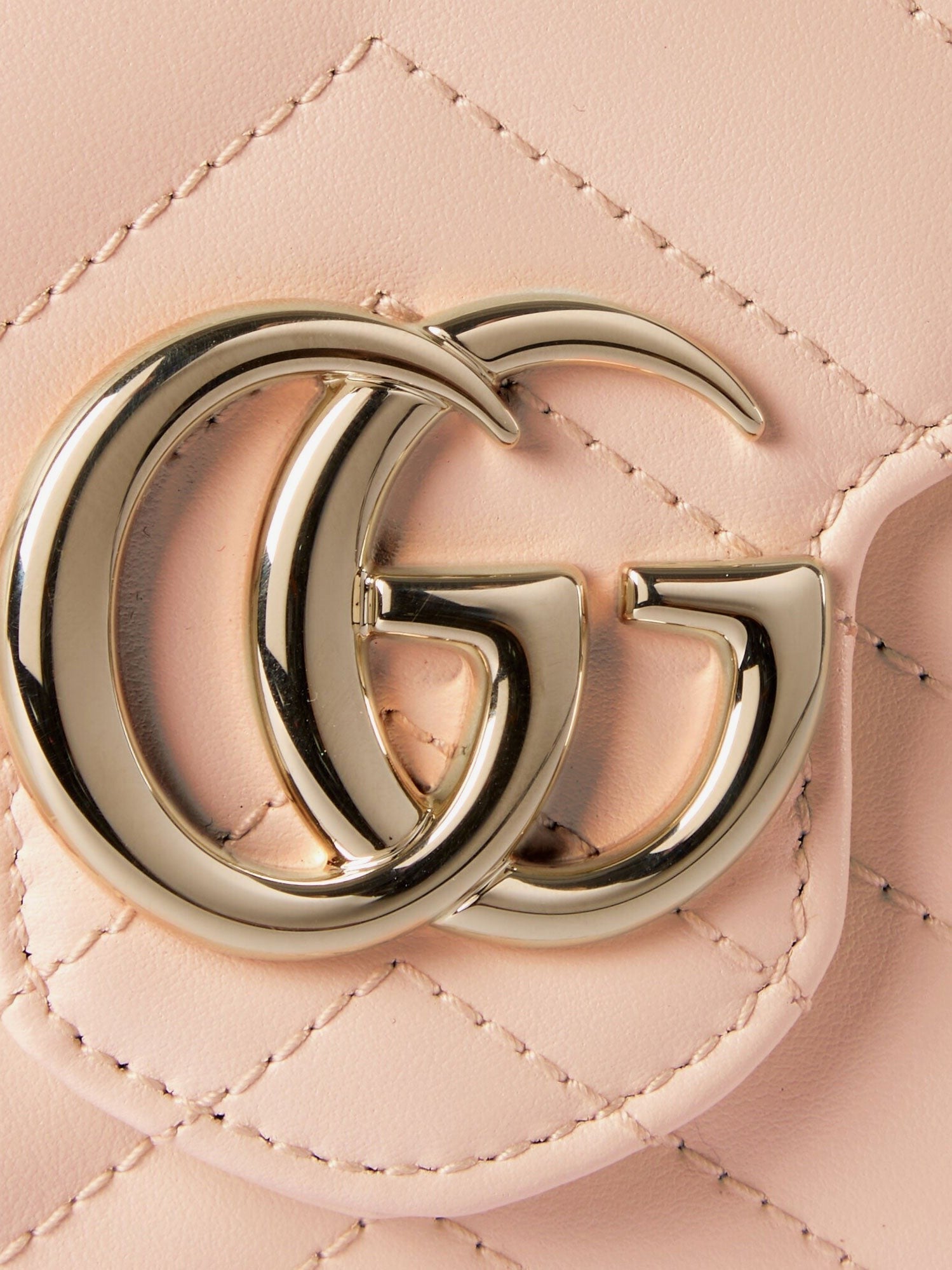 Quilted leather crossbody bag with metal GG logo