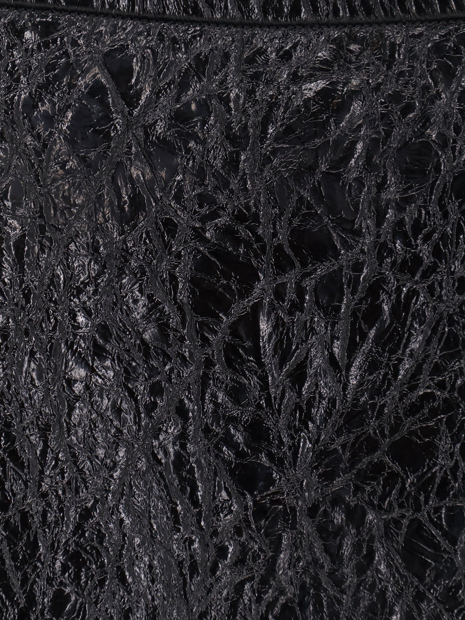 Shiny leather and neoprene skirt