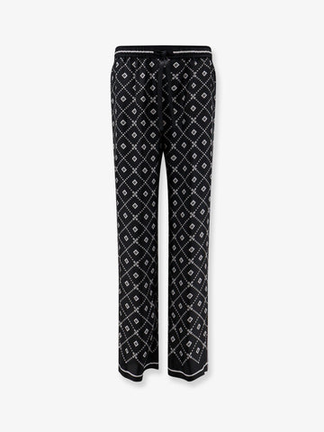 Dolce & Gabbana Silk trousers with all-over logo print