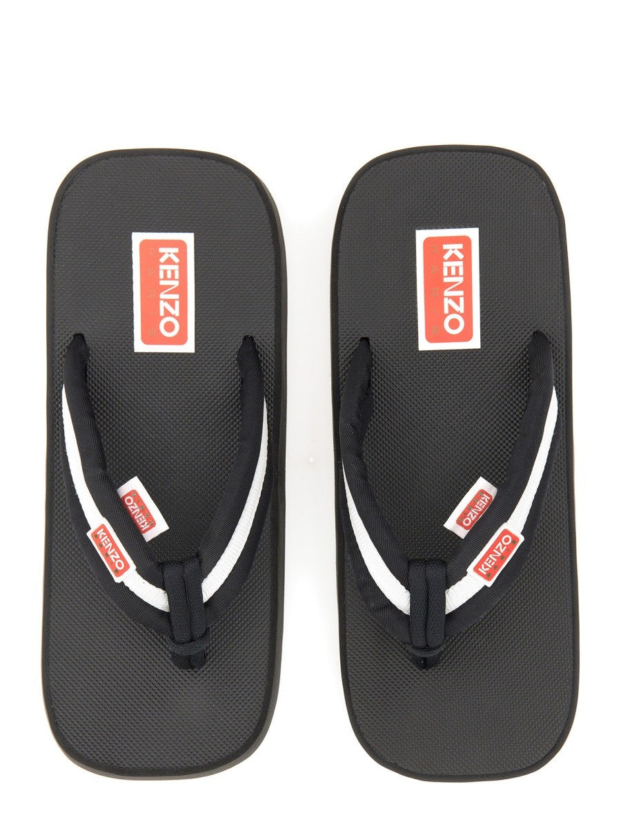 Kenzo - SLIDE SANDAL WITH LOGO slide-sandal-with-logo_7a530f3f-1f61-4cbe-b45e-8cbe5b7b1ab8