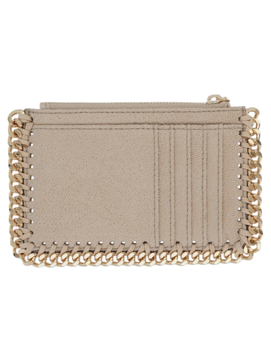 Stella McCartney Falabella zip card holder in light beige shaggy deer fabric with signature gold-tone chain detailing and zip closure.