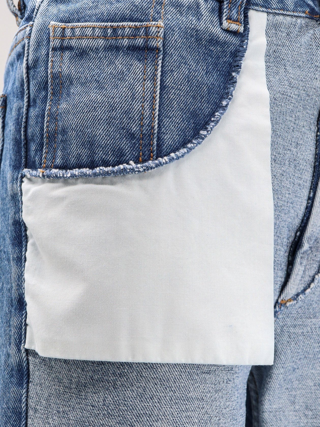 Straight leg jeans with reverse pockets