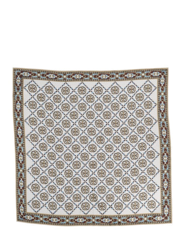 Ivory Tory Burch Deco T Monogram scarf shown flat with gently curved edges, all-over medallion pattern and decorative contrast border.