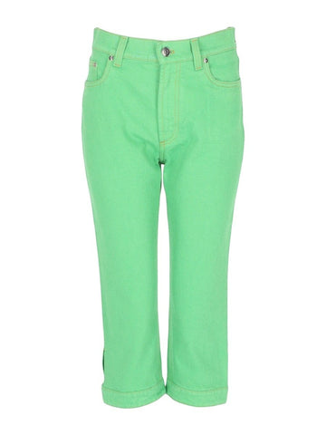 Versace Capri jeans in bright green denim with straight cropped leg, front button closure, belt loops and classic five-pocket construction.