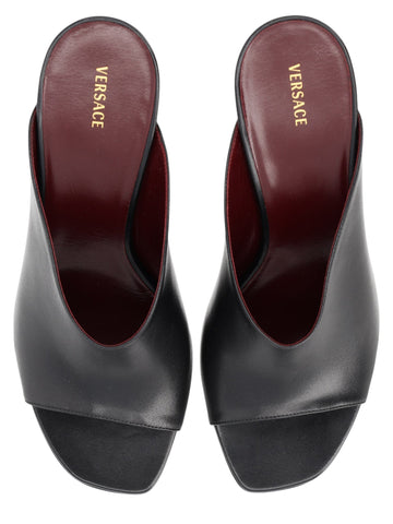 Versace black leather Giulietta mules with a 8cm heel and burgundy interior. Made in Italy.