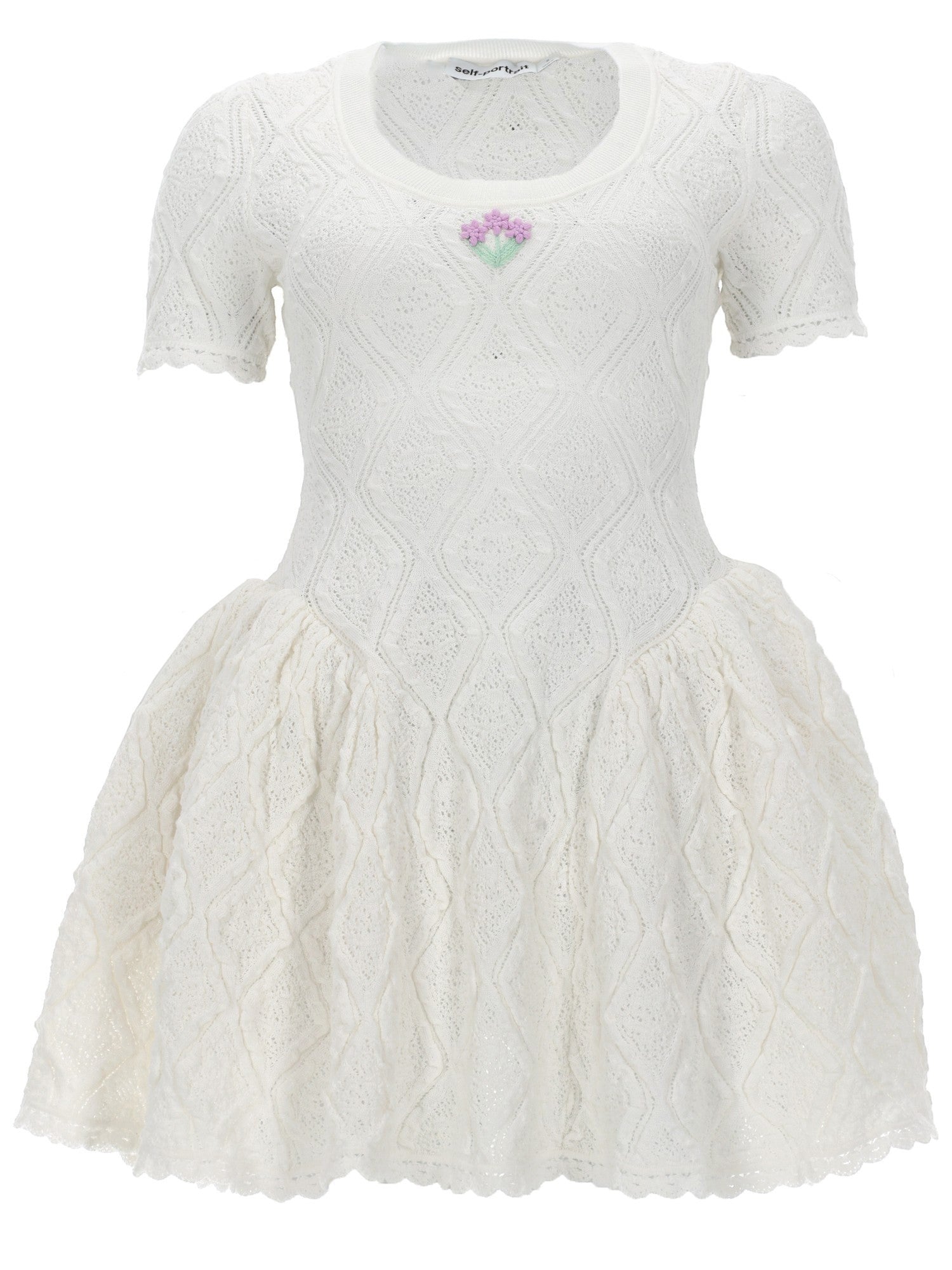 Self-Portrait white pointelle embroidered knit mini dress with short sleeves, floral embroidery at the neckline, dropped waist, flared skirt and scalloped hem.
