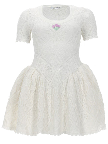 Self-Portrait white pointelle embroidered knit mini dress with short sleeves, floral embroidery at the neckline, dropped waist, flared skirt and scalloped hem.