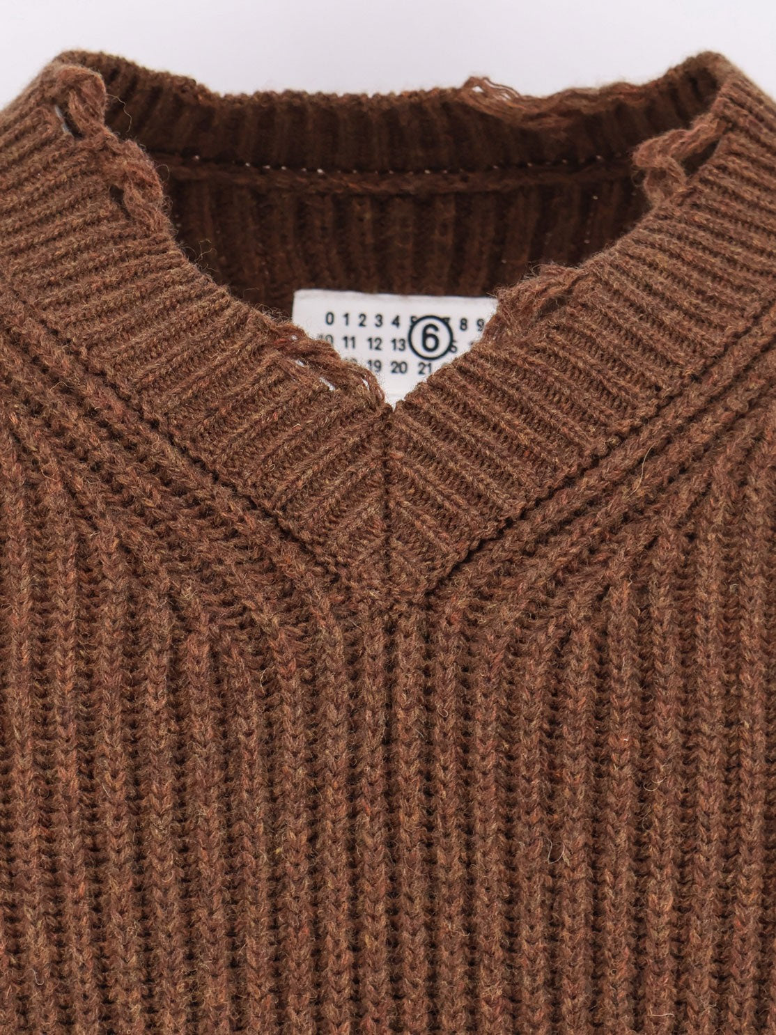 Wool blend sweater with distressed effect