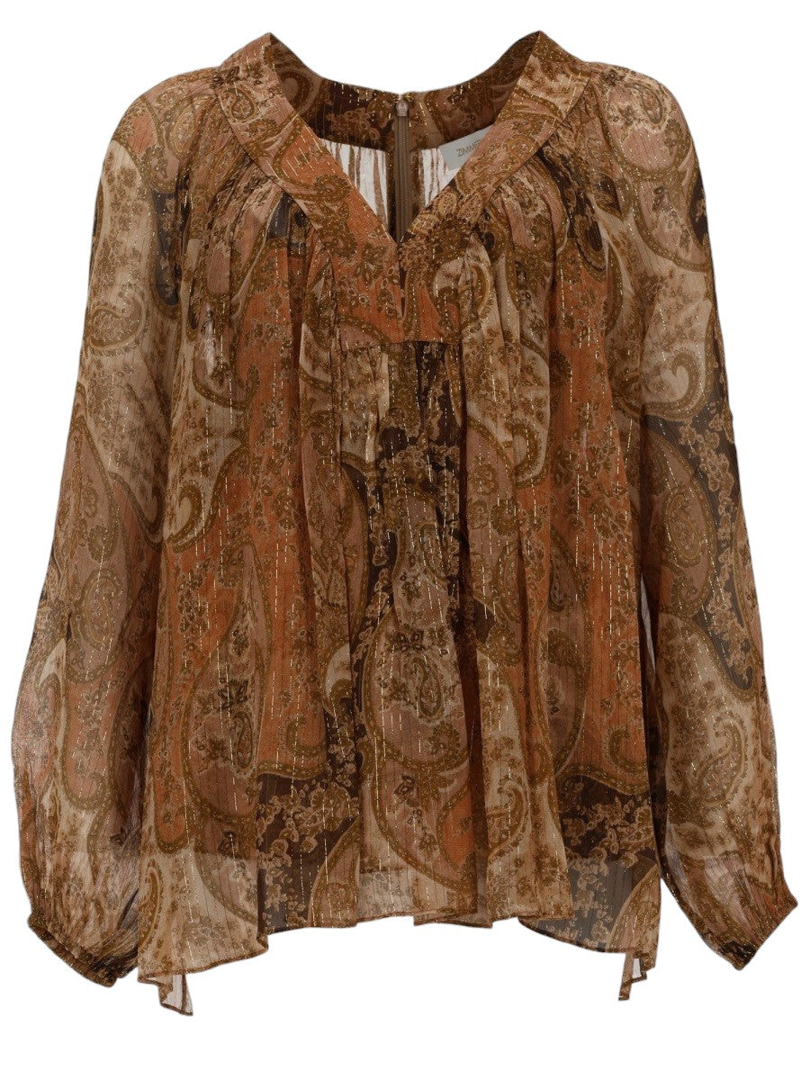 Front view of the ZIMMERMANN Carousel bat sleeve top in sheer brown paisley fabric with metallic thread detailing, tie neckline and flowing silhouette.